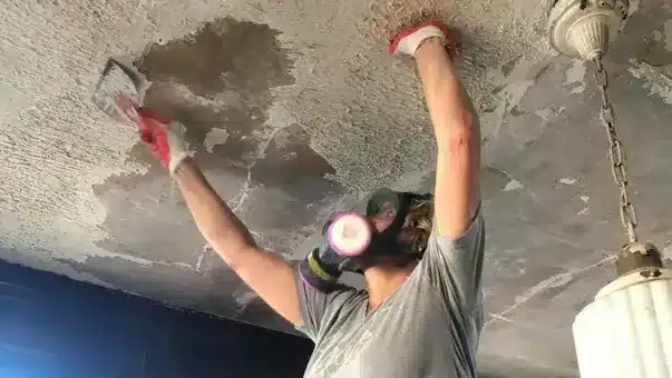 Cooksville handyman working on condo ceiling